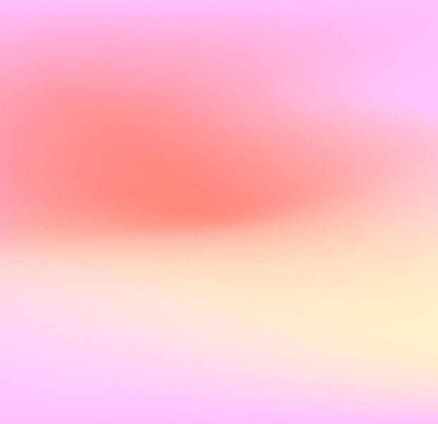 Abstract pink and yellow gradient wall mural on an interior wall