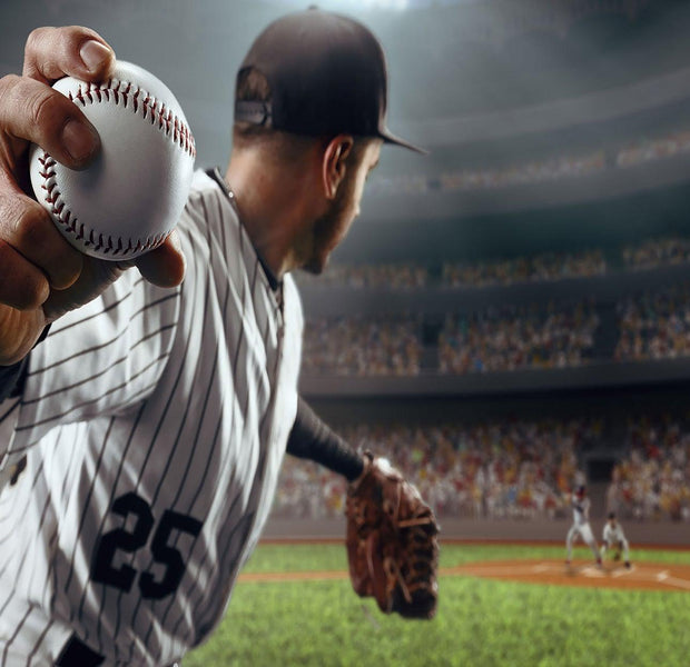 A lifelike wall mural depicting a baseball pitcher in action with a stadium background.