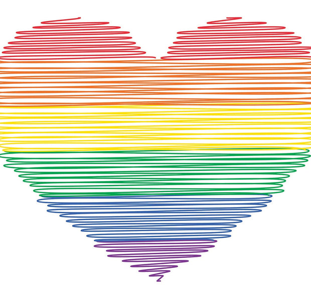 A vibrant wall mural of a heart with rainbow colors