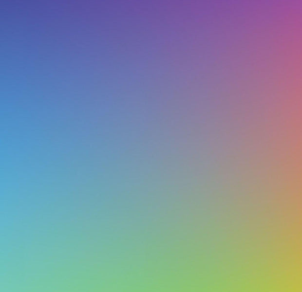 A smooth gradient mural with a spectrum of colors transitioning from purple to blue, green, yellow, and red on an interior wall