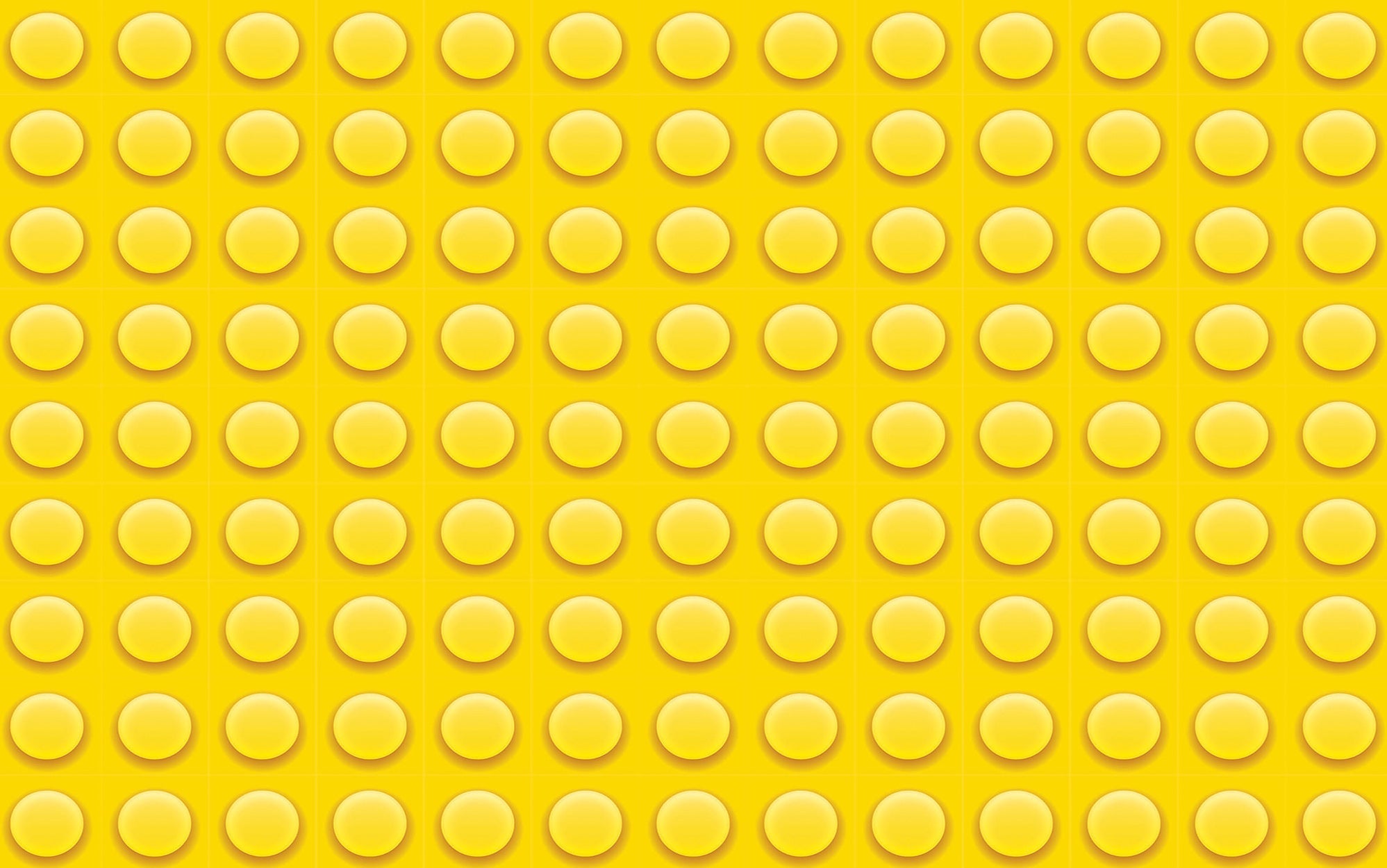 Close-up texture of a yellow LEGO plate with studs