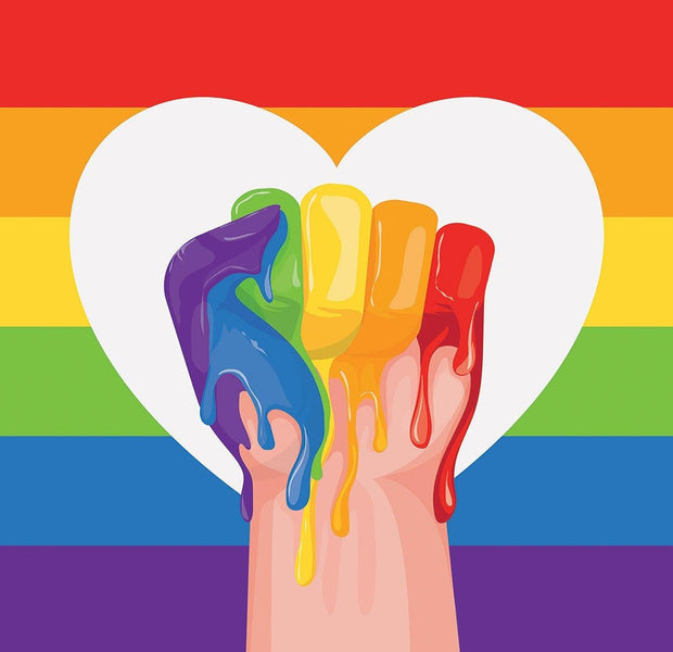 Wall mural depicting a painted hand in rainbow colors with a heart and pride flag background