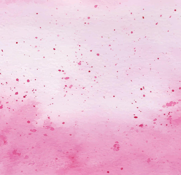 Pink watercolor texture with splatters used as a mural on a wall interior