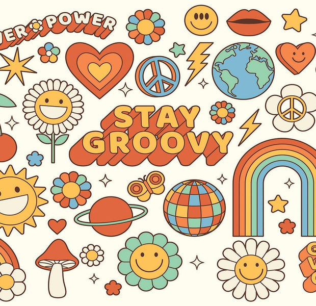 A colorful wall mural with a 70s retro hippie theme including phrases like Stay Groovy and Good Vibes Only with peace signs, hearts, rainbows, and flowers.