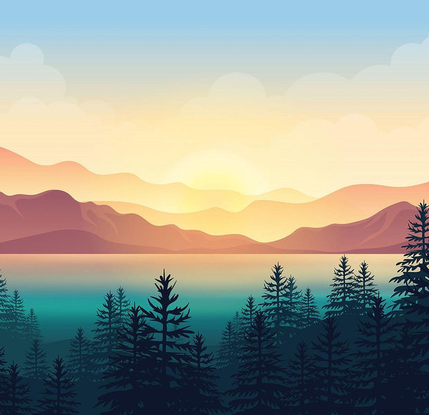 Wall mural of a sunset over a mountainous landscape with silhouettes of trees in the foreground