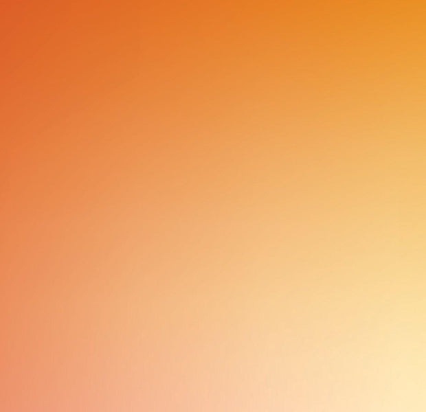 An expansive gradient wall mural transitioning from orange to white in an interior space.