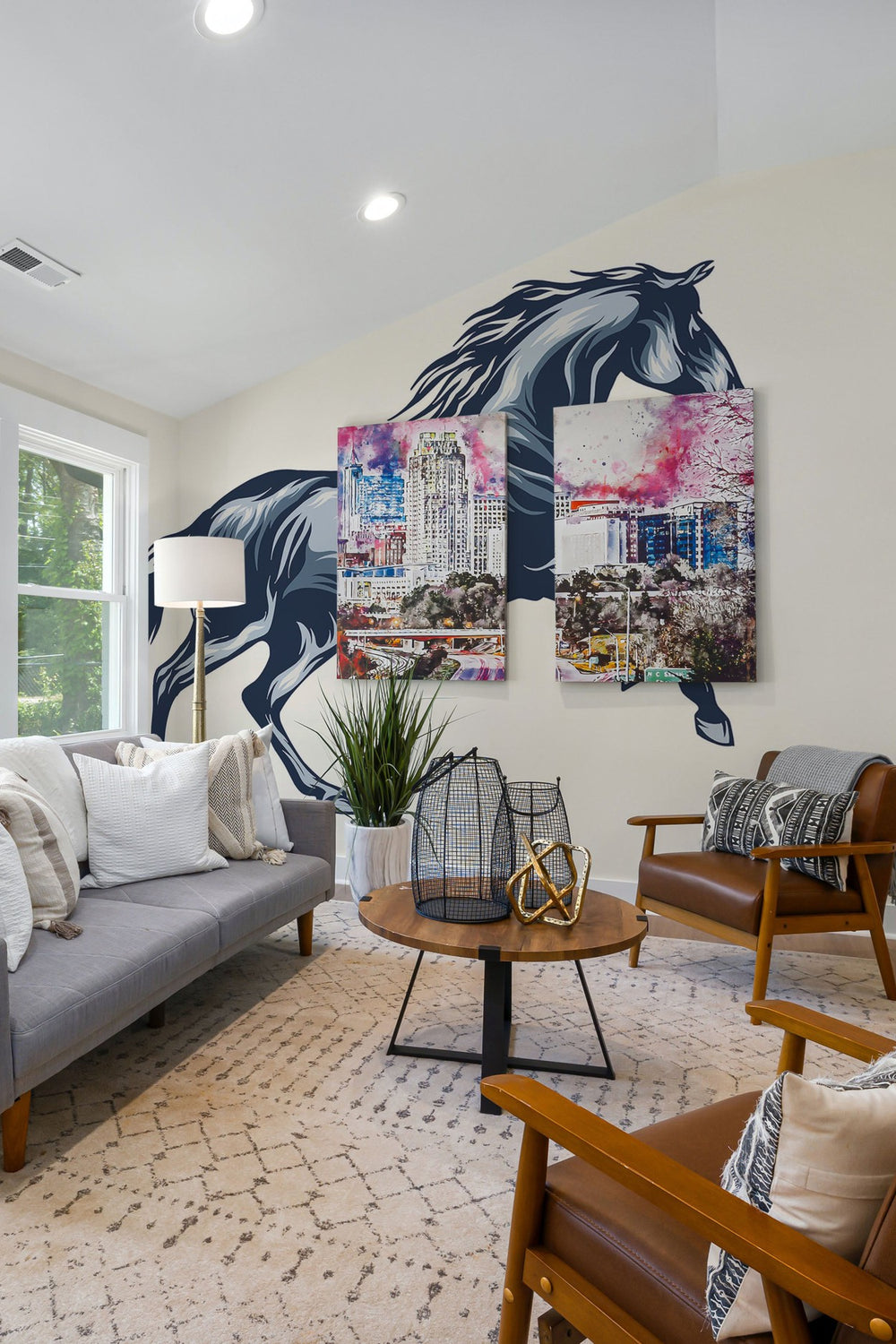 A stylish living room interior with a large wall mural of a blue horse and a colorful cityscape canvas.