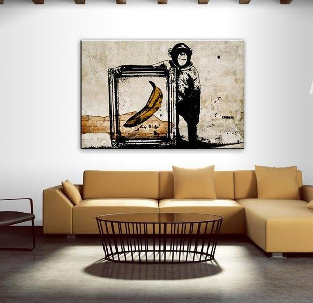 Stretched Canvas Street Art - Banksy: Monkey With Banana In Frame Sepia