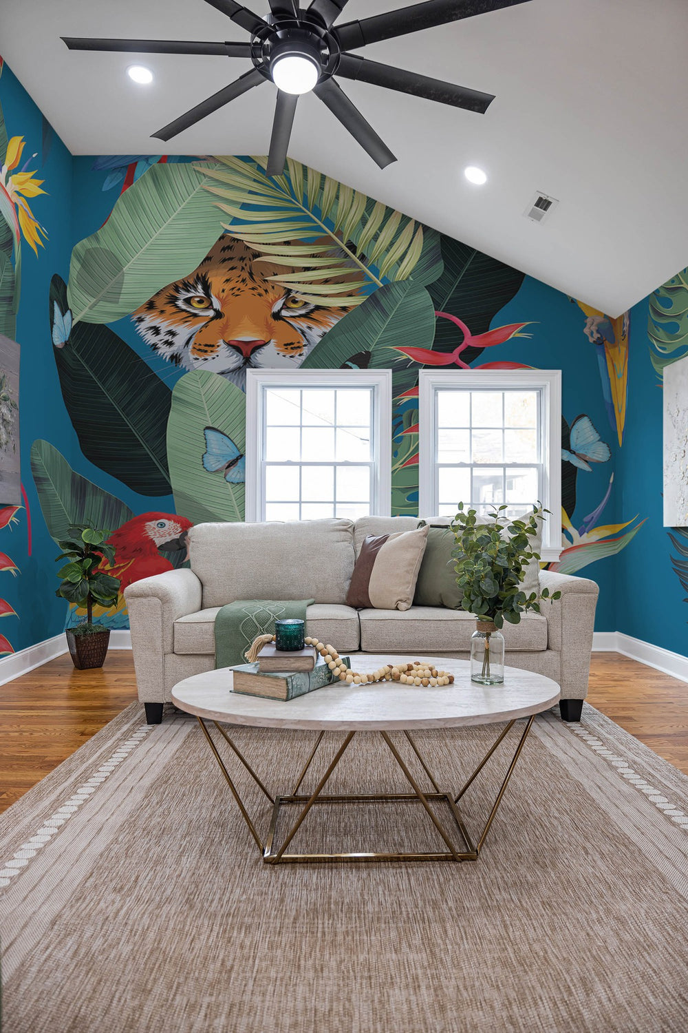 A vibrant living room interior with a large wall mural featuring a tropical jungle theme complete with a prominent tiger illustration.‚Äù
