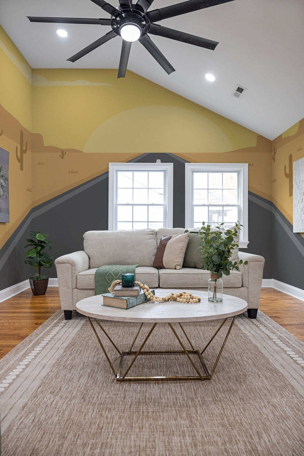 Elegant living room interior with yellow and gray wall mural, comfortable sofa, glass coffee table, and houseplants
