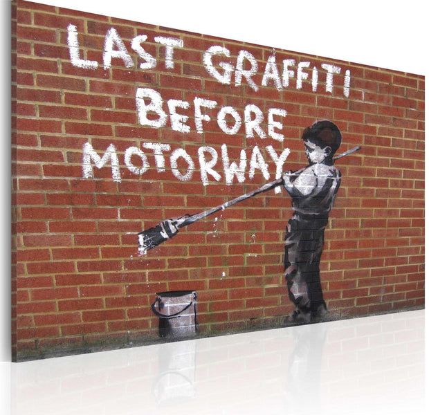 Stretched Canvas Street Art - Banksy: Last Graffiti Before Motorway-Tiptophomedecor